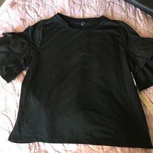 Black shirt with ruffle sleeves